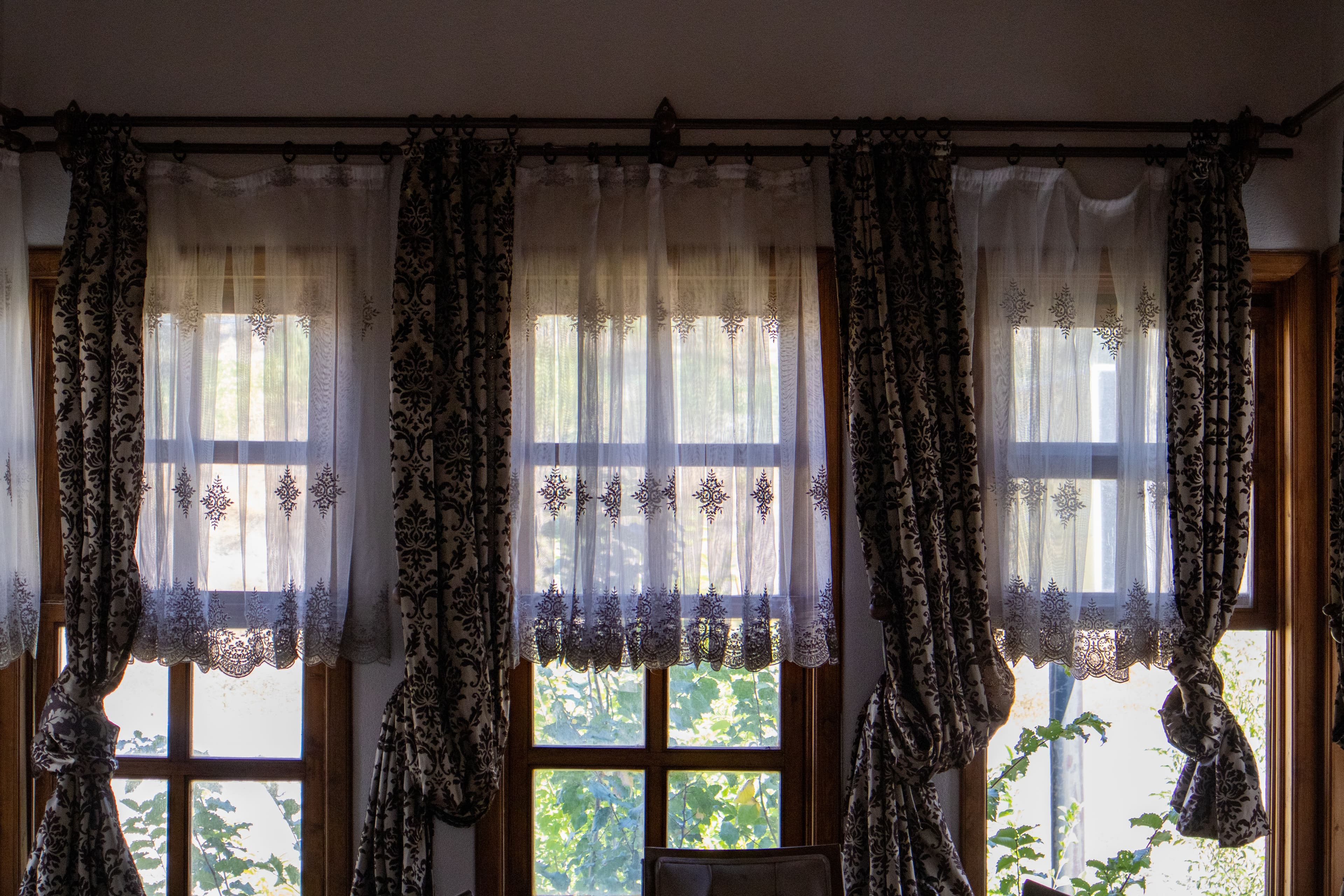 Curtains specialist care — Floor-length curtain panel after household dry cleaning service