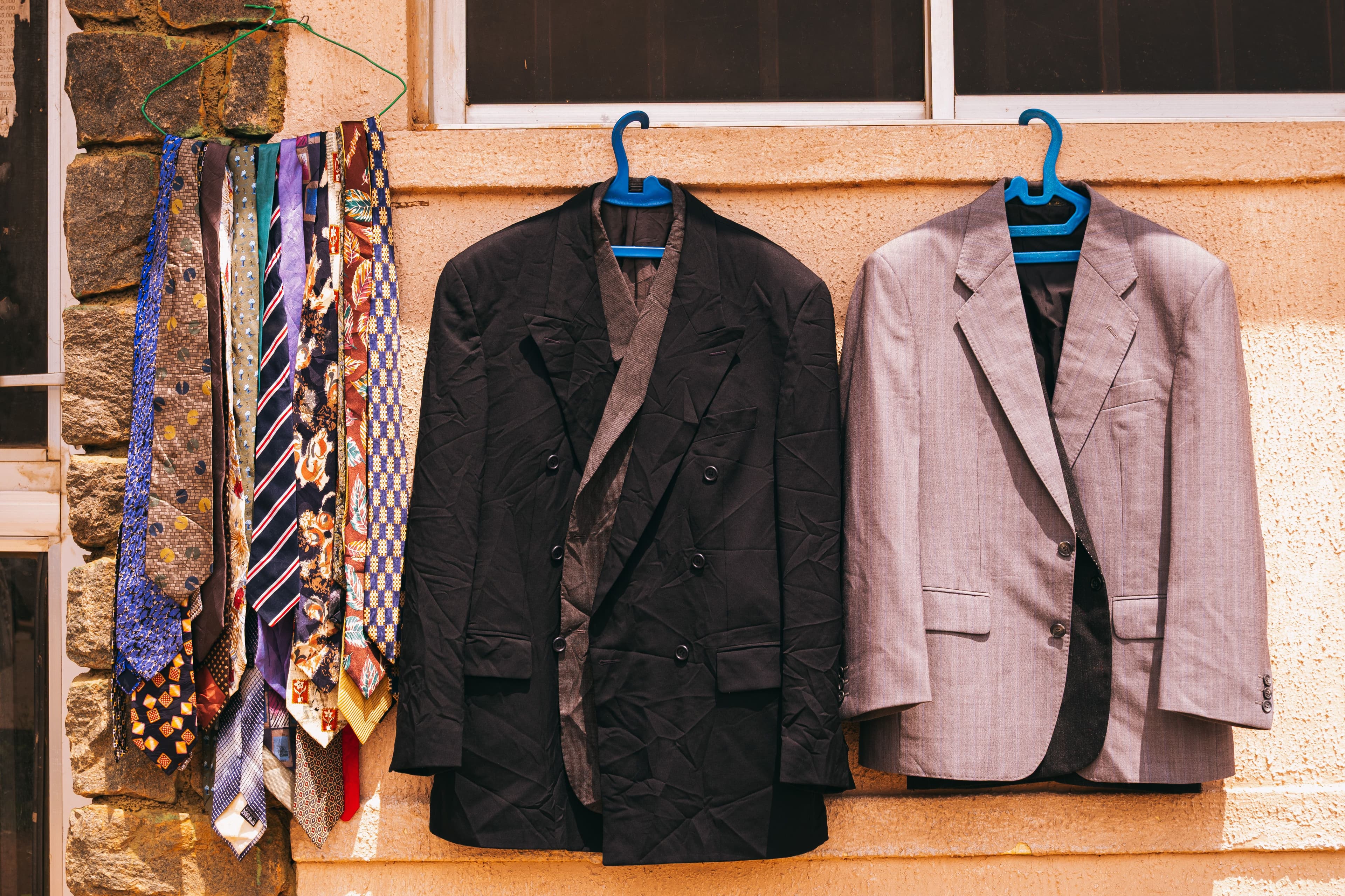 Suits specialist care — Men's formal suit on a hanger after dry cleaning and press